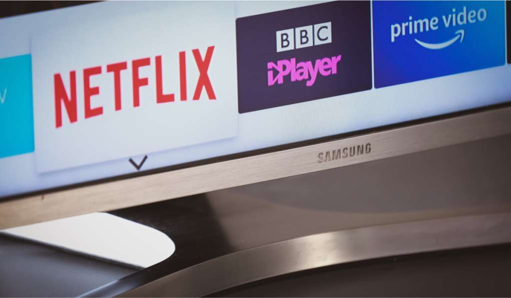 A Samsung TV with three app logos on the screen: Netflix, BBC iPlayer and Prime Video